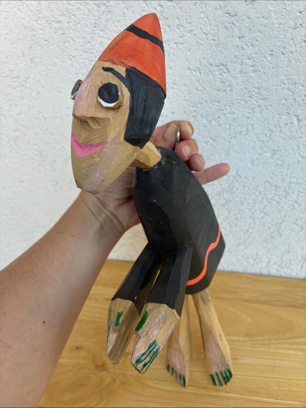 Strange hand carved folk art character with bland and orange clothes and a hook - Picture 4 of 13